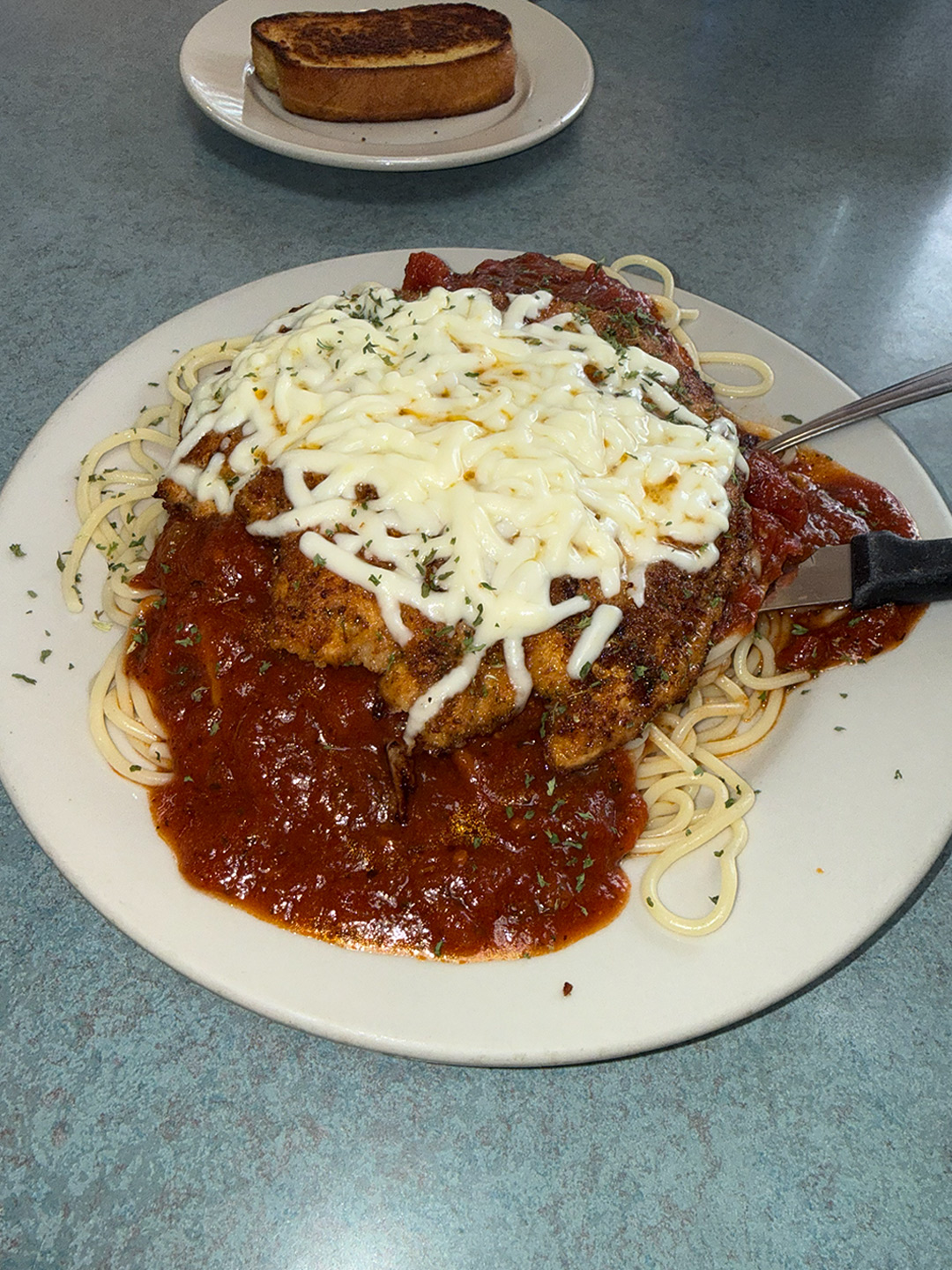 Chicken Parmesan with spaghetti at Golden Bear Restaurant in Largo, Florida