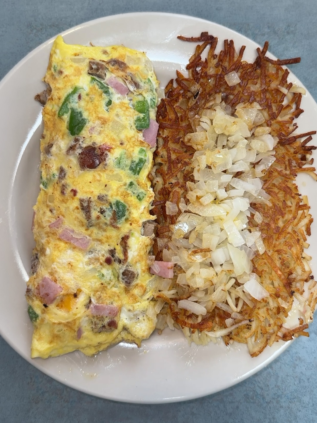 Omelette with hash browns at Golden Bear Restaurant in Largo, Florida