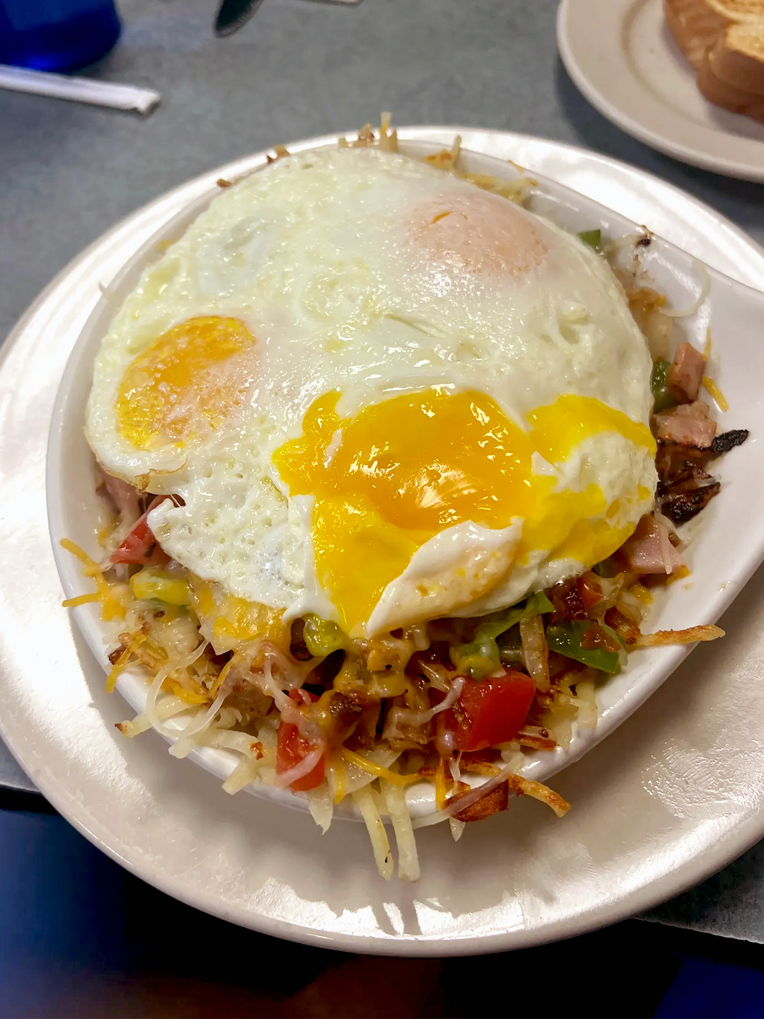 Breakfast skillet with sunny-side-up eggs at Golden Bear Restaurant in Largo, Florida